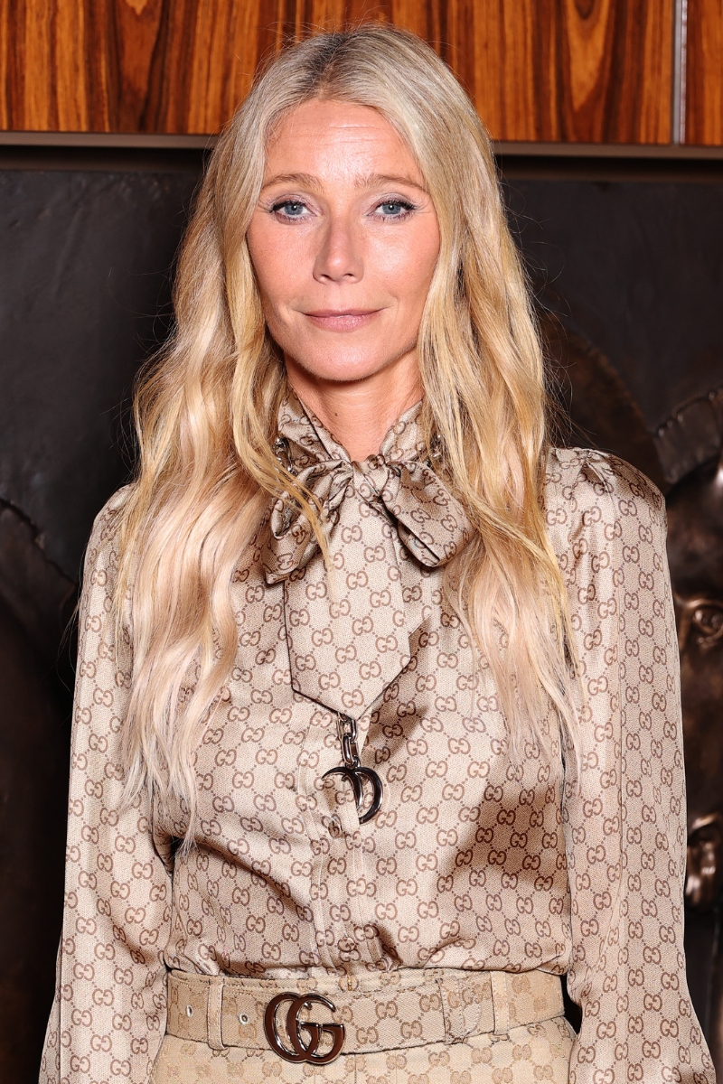 Gwyneth Paltrow is pictured wearing a Gucci blouse, belt and skirt, with her hair styled in loose, beachy waves at the Gucci Spring Summer 2026 event during the Milan Fashion Week at Palazzo Mezzanotte on September 23, 2025 in Milan, Italy.