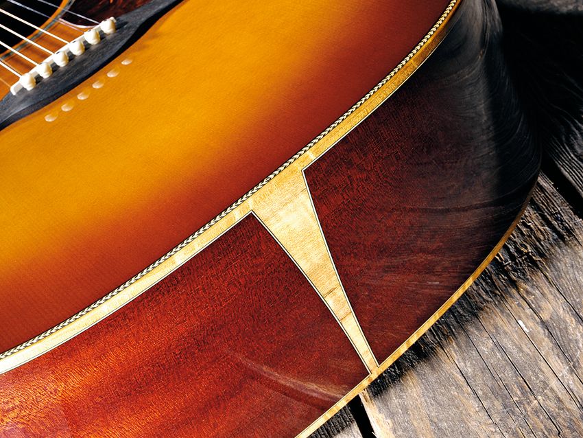 The coachlined figured binding is in the unusual myrtlewood