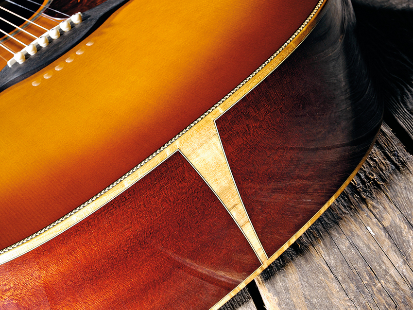 The coachlined figured binding is in the unusual myrtlewood