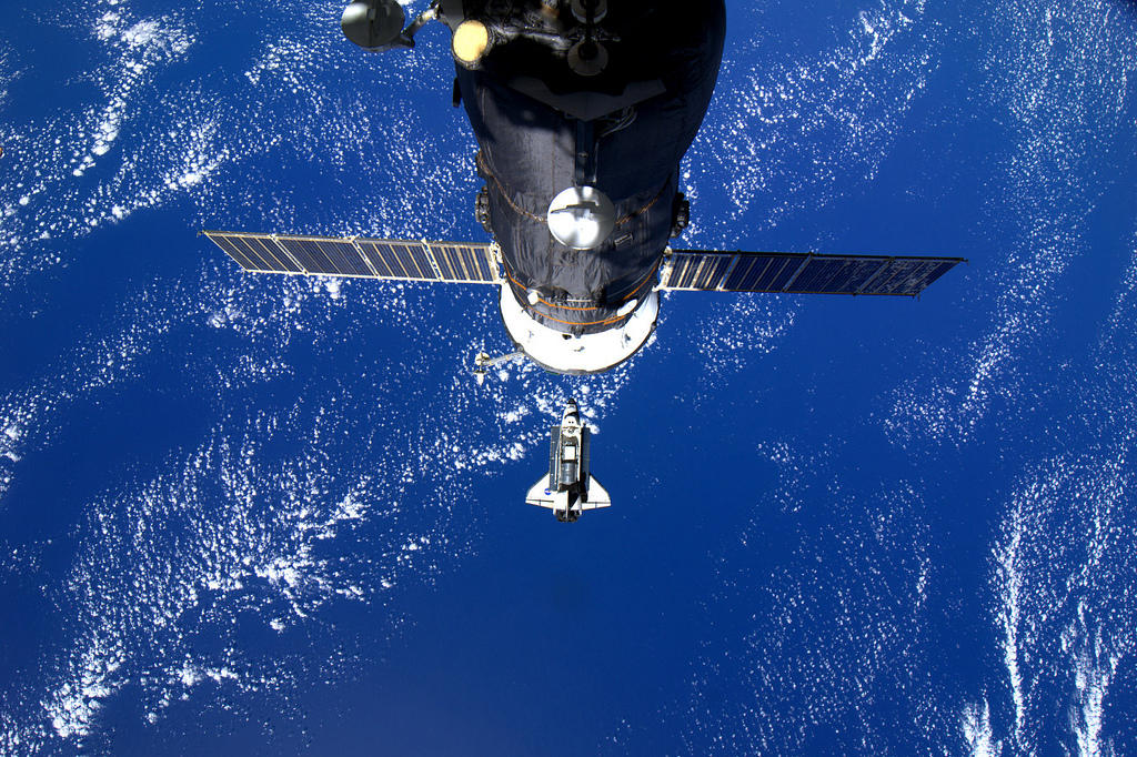 Space shuttle Discovery is seen pulling up to the International Space Station on Feb. 26, 2010 during docking day for its final space mission STS-133.