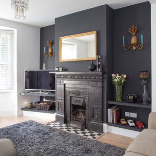 black living room wall with black iron fireplace