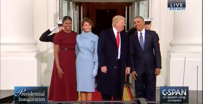 Obamas greet Trumps at White House. 
