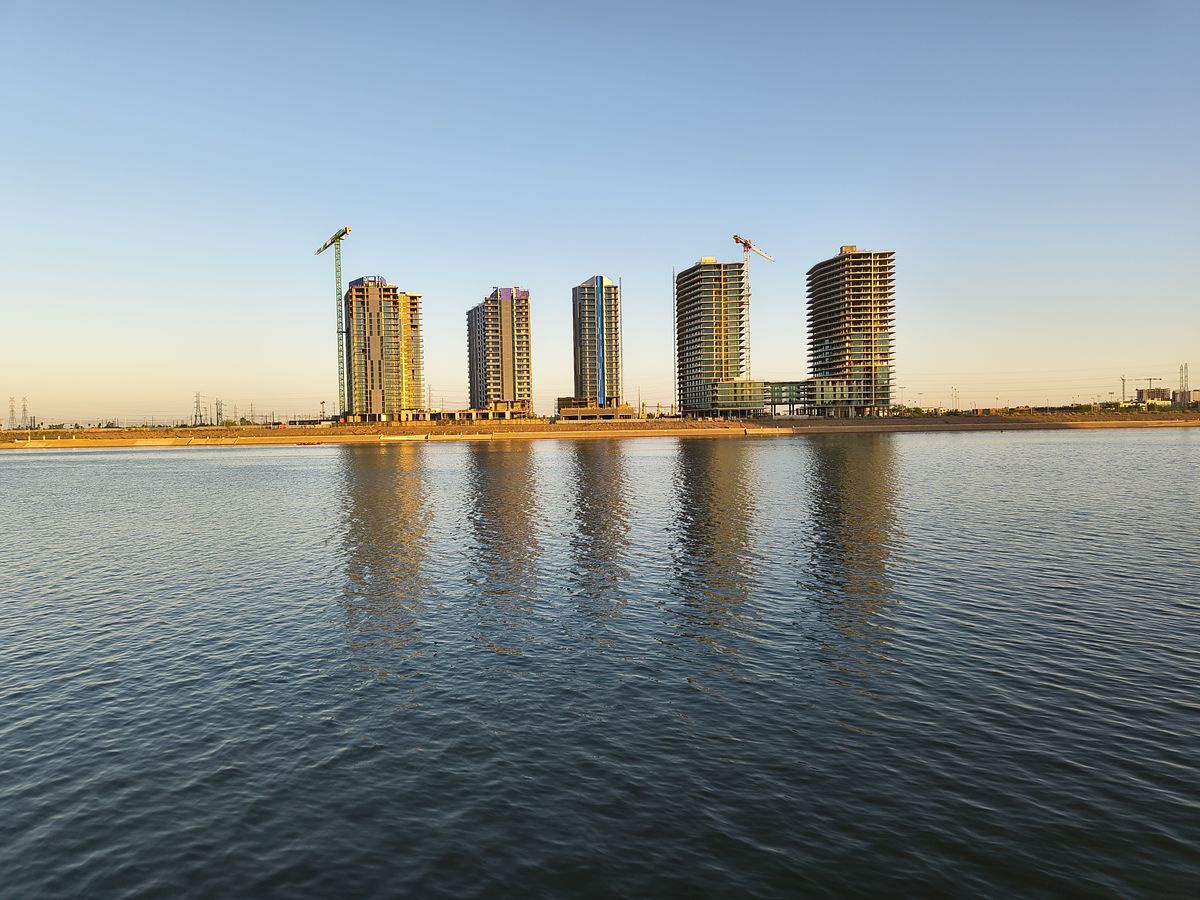 A photo of a lake and buildings captured with the Motorola Razr 2025 at 1x zoom.