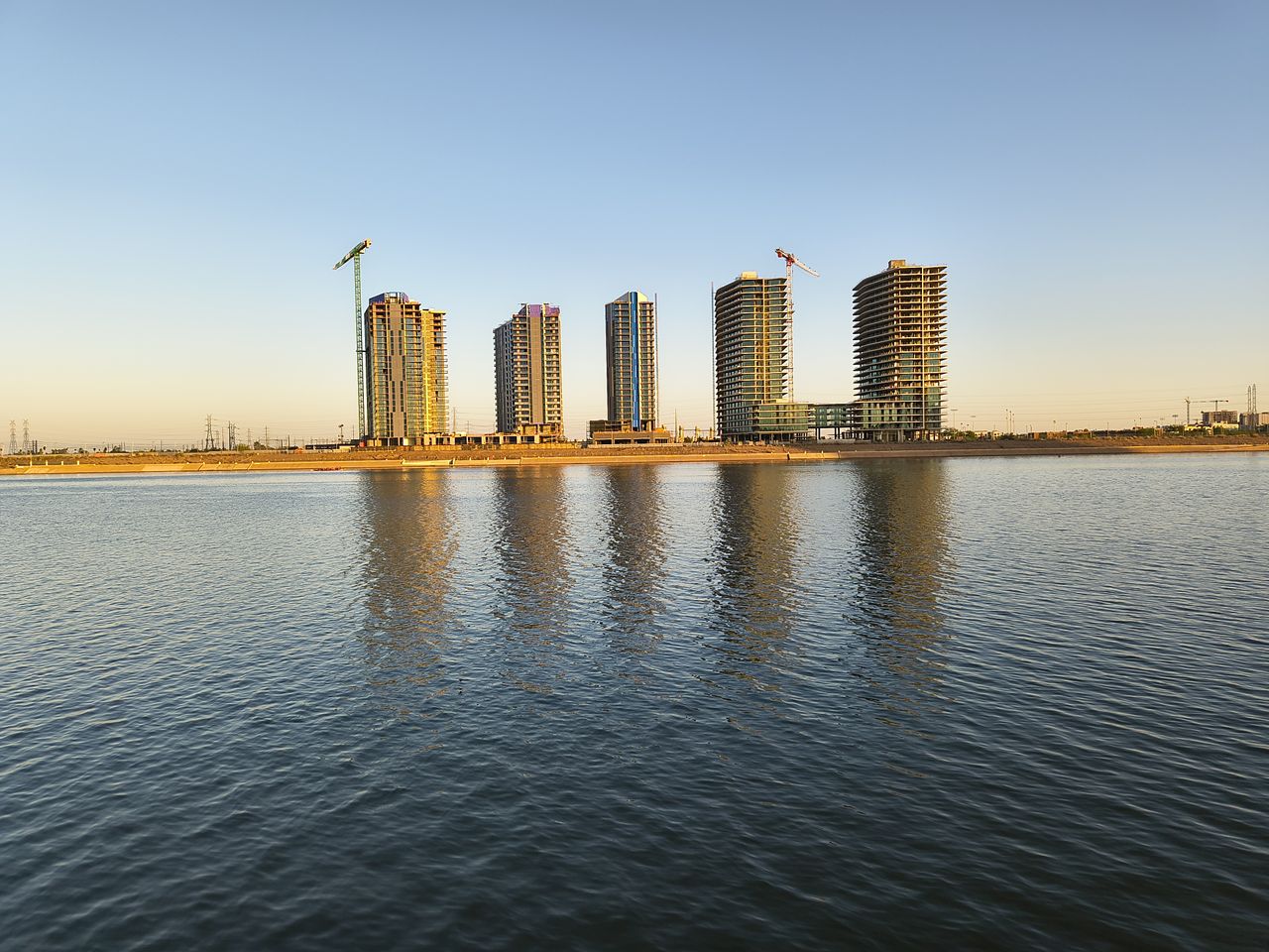 A photo of a lake and buildings captured with the Motorola Razr 2025 at 1x zoom.