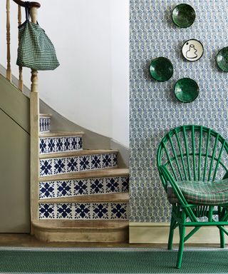 Modern hallway with patterned paper and green chair
