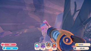 Radiant Ore in Slime Rancher 2 poking out of a rock