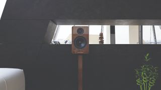 A single Acoustic Energy AE1 Active speaker in a loft space