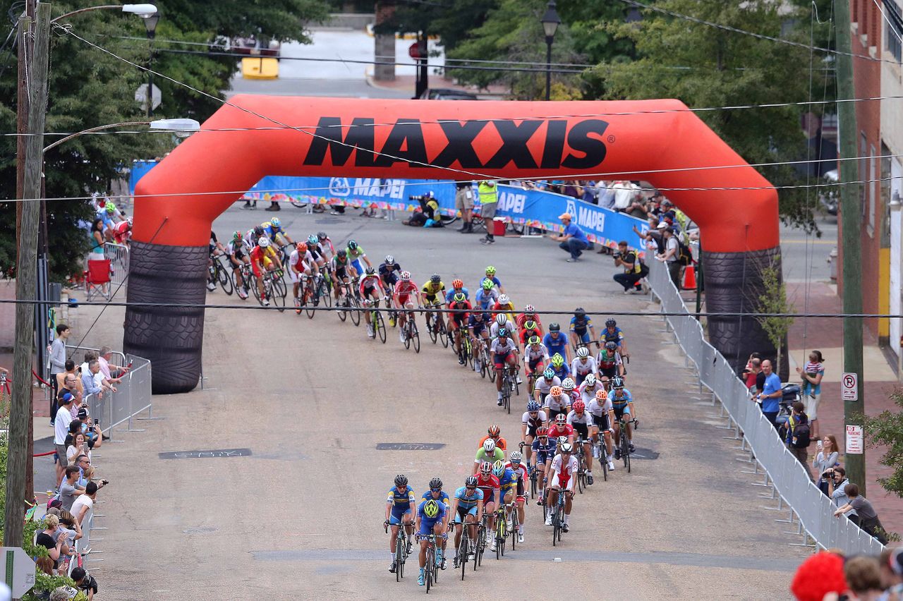 The peloton snakes under the Maxxis signage