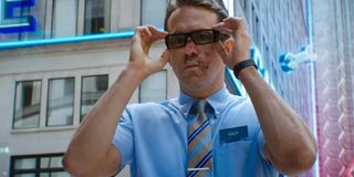 Free Guy Ryan Reynolds putting a pair of glasses on