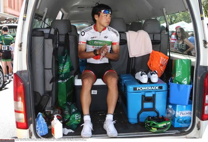 Yukiya Arashiro (Europcar) protects against the elements.