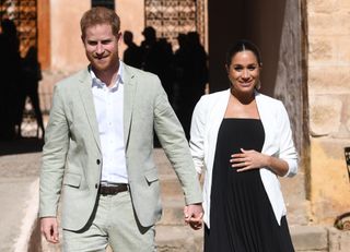 Prince Harry, Duke of Sussex and Meghan, Duchess of Sussex walk through the walled public Andalusian Gardens which has exotic plants, flowers and fruit trees during a visit on February 25, 2019 in Rabat, Morocco