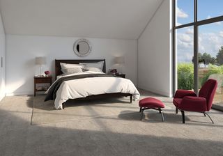 bedroom with white walls and red armchair