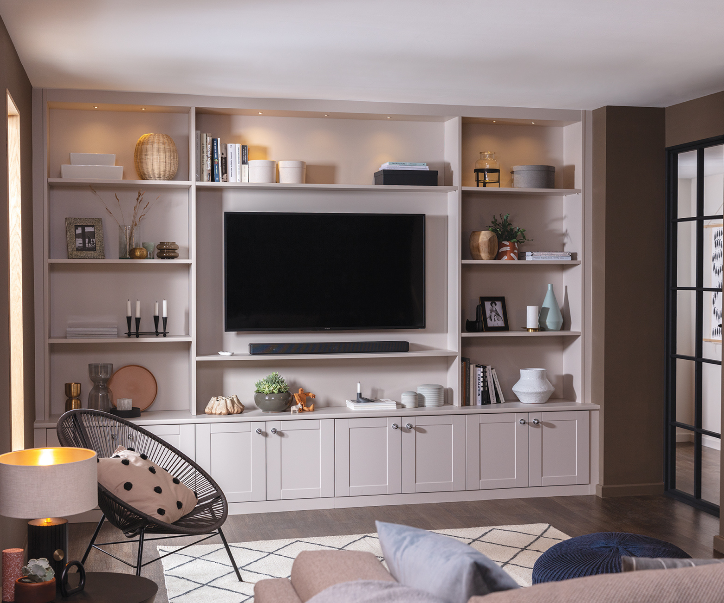 Media wall with spotlights on top cabinets