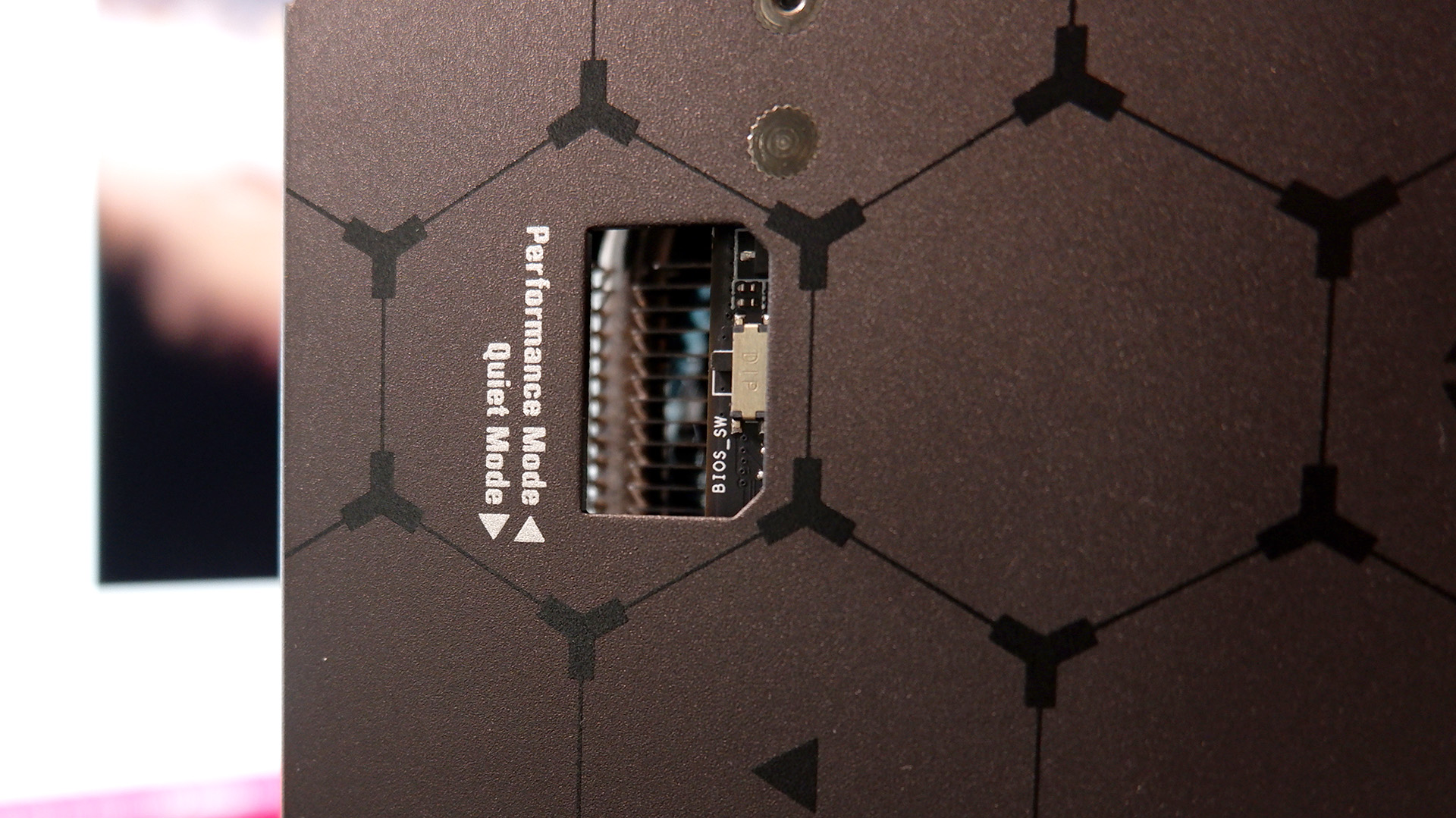 Asus Radeon RX 7800 XT TUF Gaming OC Edition on a black desk.