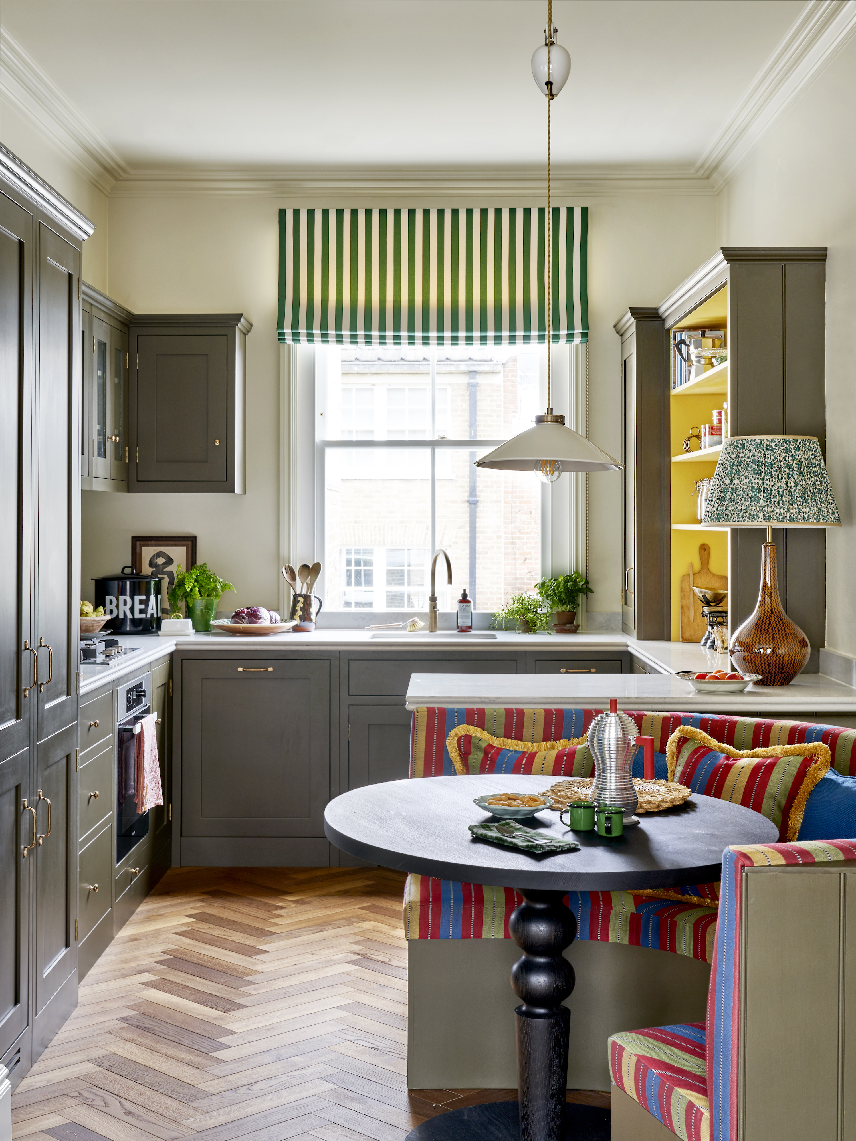 Open-plan kitchen with curved banquette