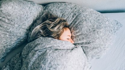 High Angle View Vie Of Woman Sleeping On Bed - stock photo