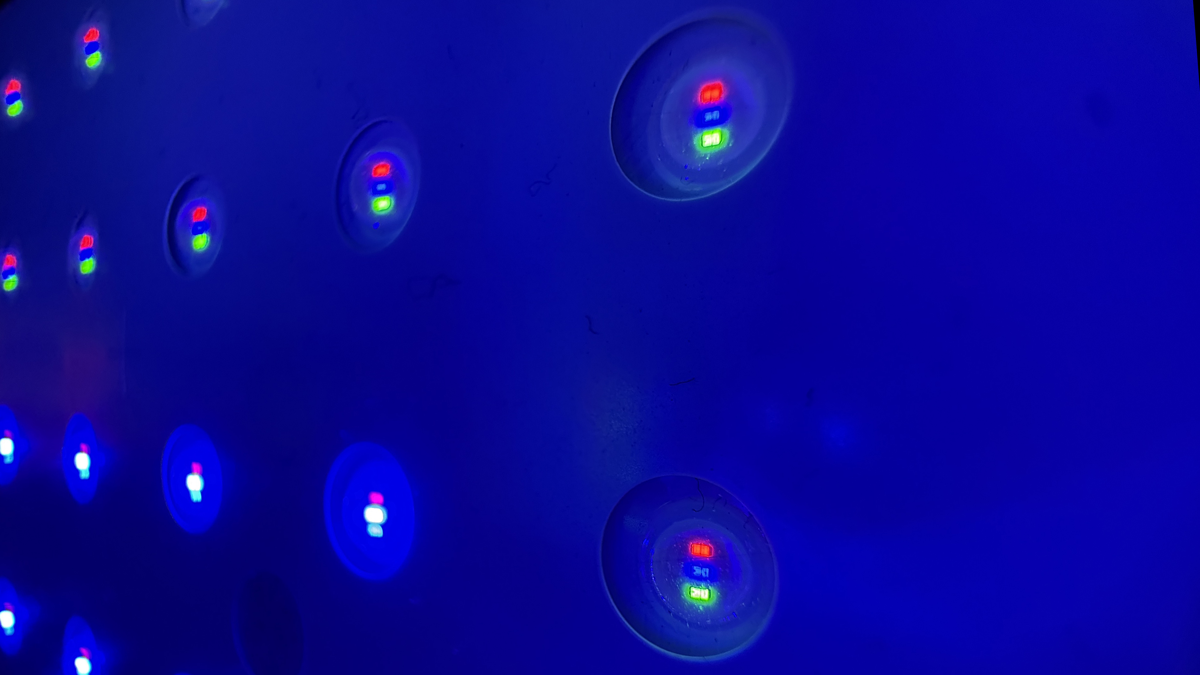A close-up of an RGB mini-LED unit from an RGB TV backlight, showing the individual red, green and blue sub-pixels