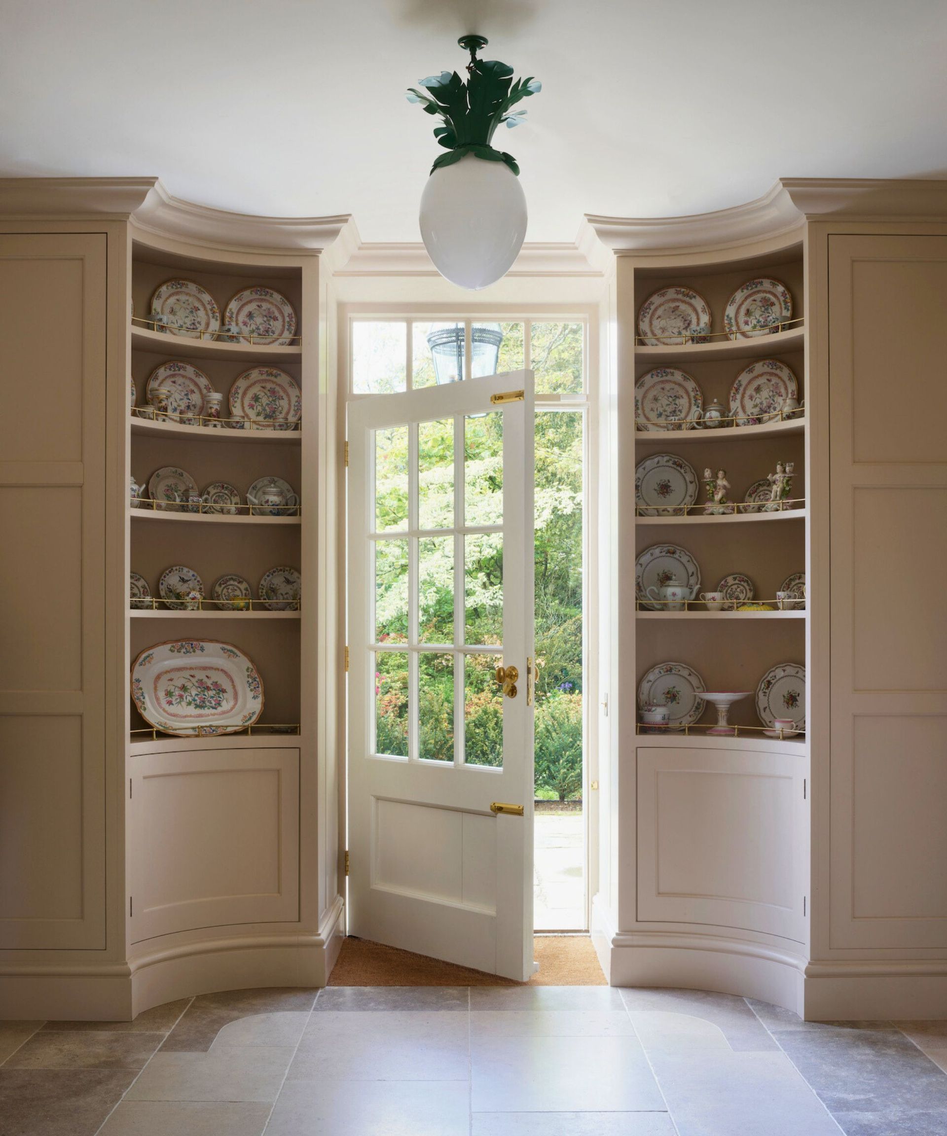 Two china cabinets frame an open door