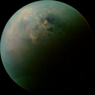 Infrared data collected by Cassini was used to piece together this false-color mosaic of Titan, highlighting the surface materials around the moon's hydrocarbon lakes.