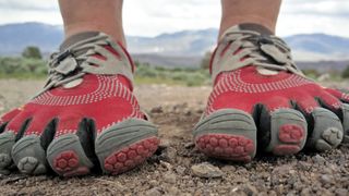 Person's feet wearig Vibram FiveFingers shoes