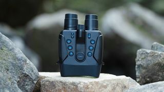 Yashica Night Vision 4K binoculars stood on a rock