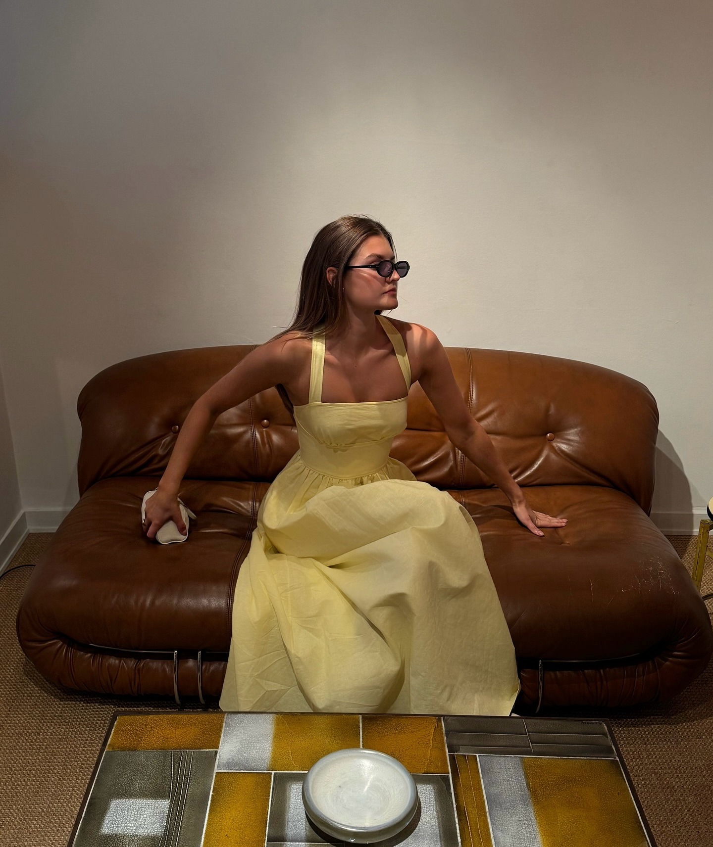 Woman in pale yellow dress.