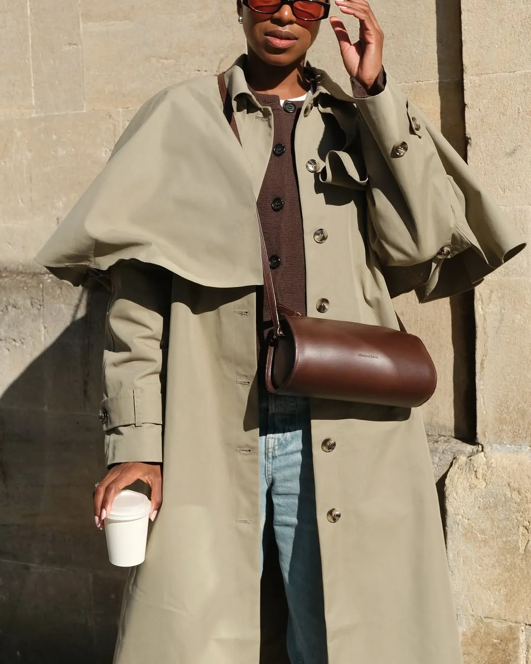 image of woman carrying cylinder bag
