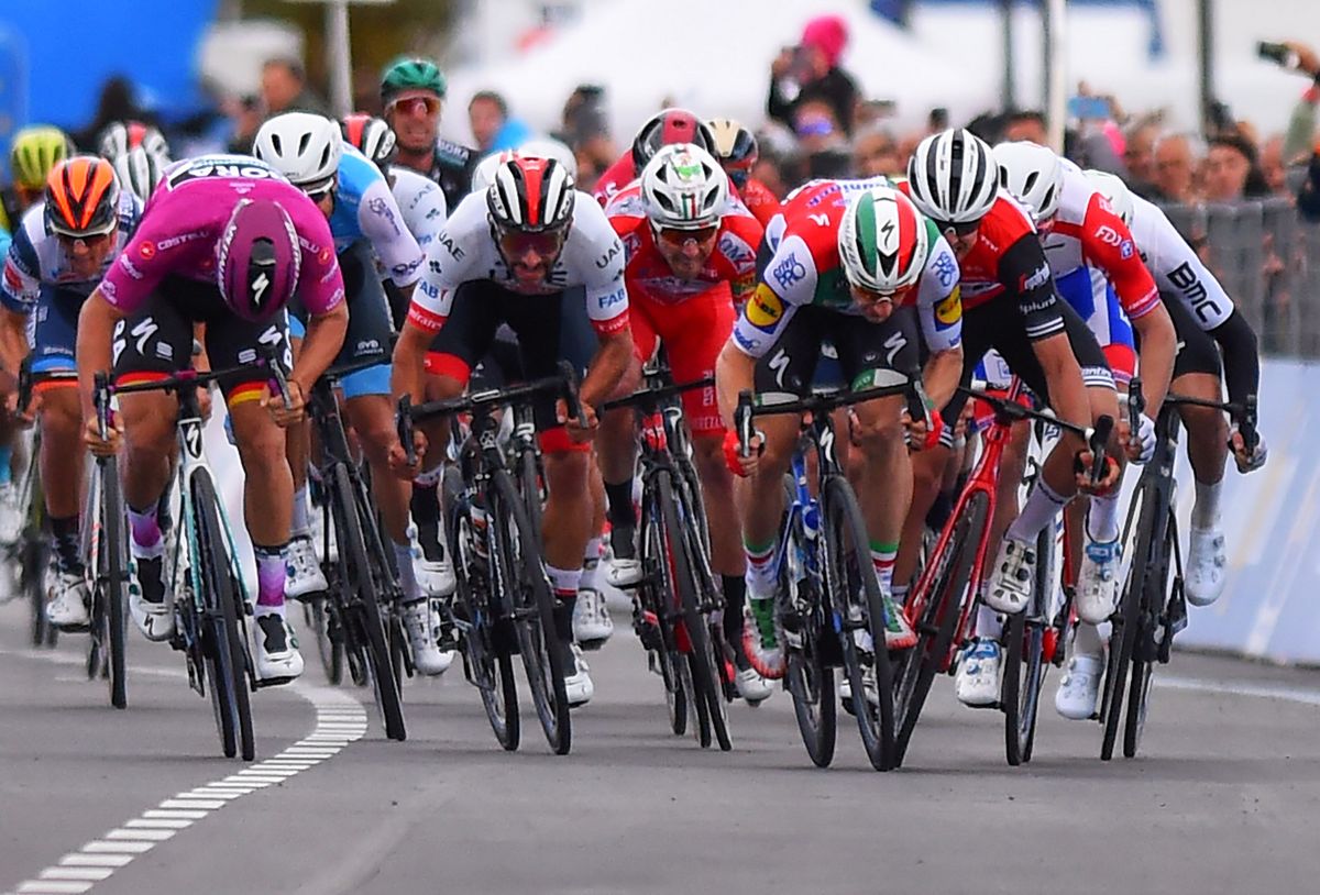 Viviani swerves into Moschetti in the sprint to the line