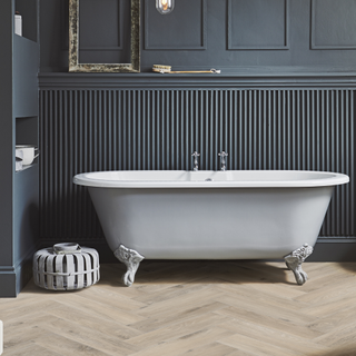 Herringbone lvt tile and freestanding bath in bathroom