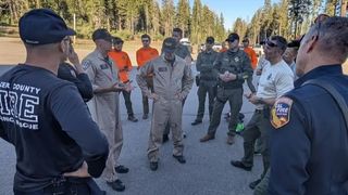 An image released by Placer County Sheriff's Office shows rescue crews assembled in search for 3 men who jumped into Rattlesnake Falls