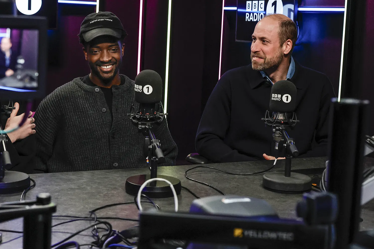 Prince William sitting with a man at a BBC studio