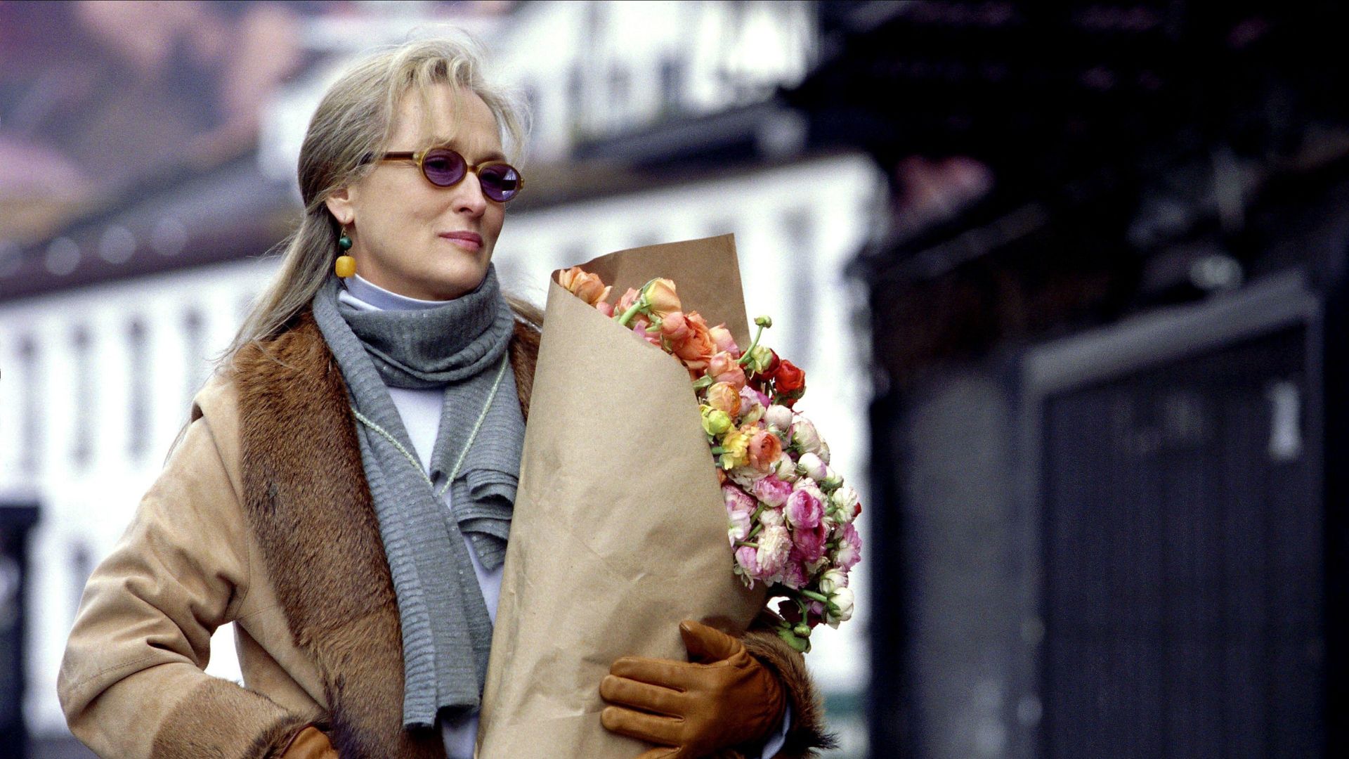 Meryl Streep holding a bouquet of flowers in The Hours