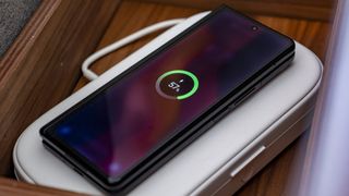 The Galaxy Z Fold 3 on a wireless charger