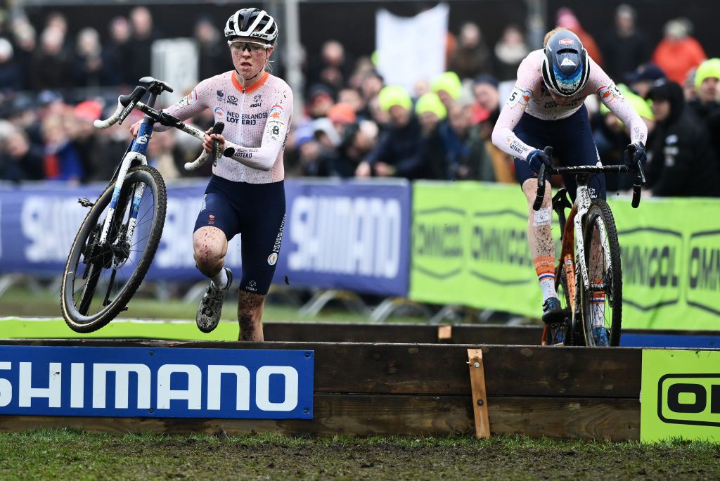 HOOGERHEIDE NETHERLANDS FEBRUARY 04 LR Fem van Empel of The Netherlands and Puck Pieterse of The Netherlands compete during the 74th World Championships CycloCross 2023 Womens Elite CXWorldCup Hoogerheide2023 on February 04 2023 in Hoogerheide Netherlands Photo by David StockmanGetty Images