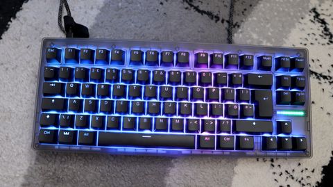 The Wooting 8-HE on a mouse pad with RGB lighting enabled.