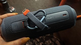 JBL Flip 7 back panel showing two carry clips and USB-C port