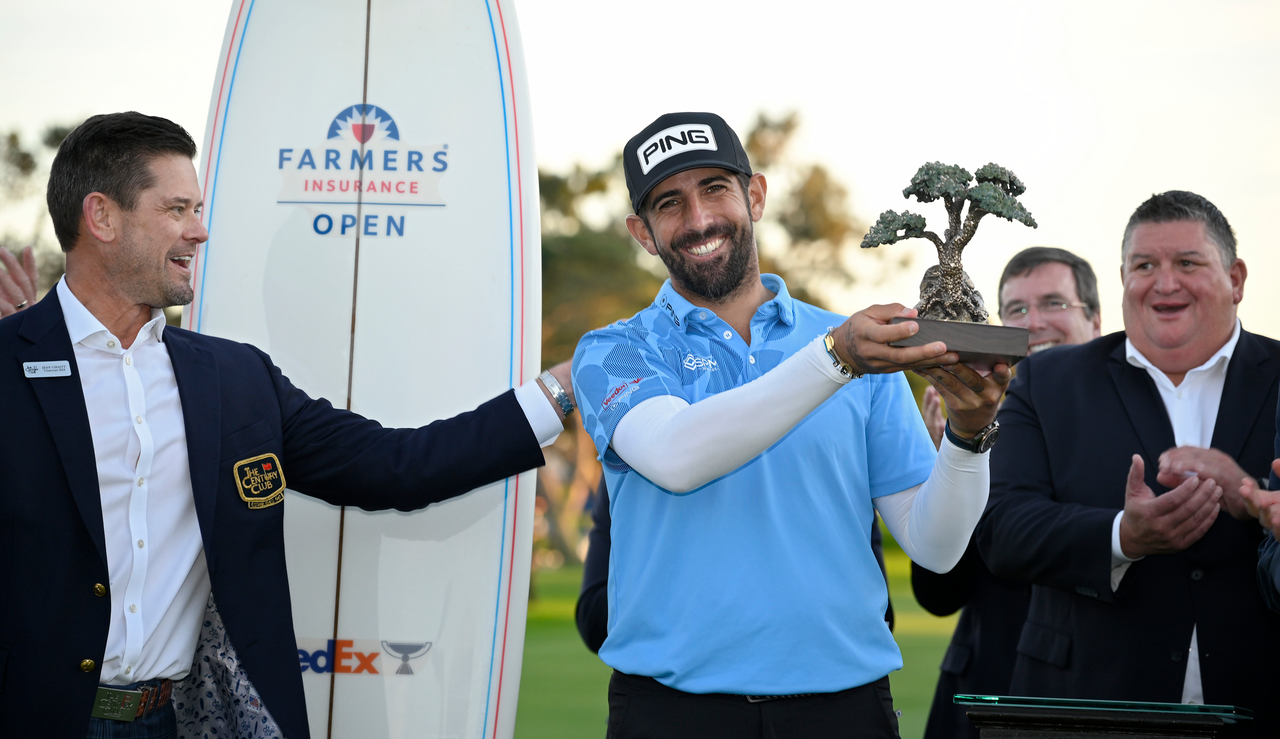 Matthieu Pavon holds the Farmers Insurance Open trophy