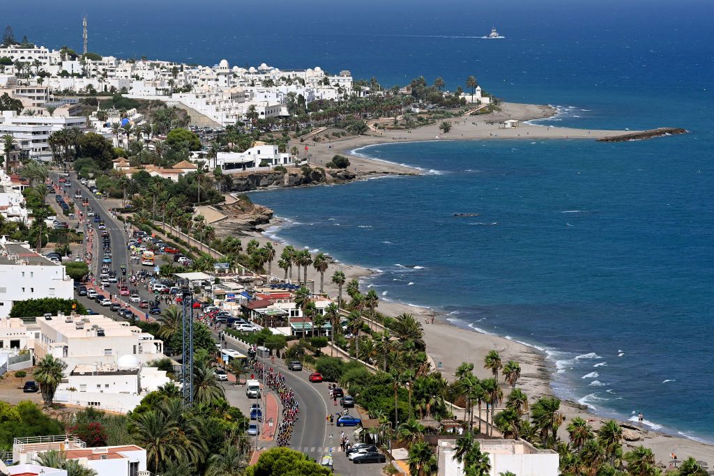 CABO DE GATA SPAIN AUGUST 31 A general view of the peloton passing through a sea landscape during the 77th Tour of Spain 2022 Stage 11 a 1912km stage from ElPozo Alimentacin Alhama de Murcia to Cabo de Gata LaVuelta22 WorldTour on August 31 2022 in Cabo de Gata Spain Photo by Justin SetterfieldGetty Images