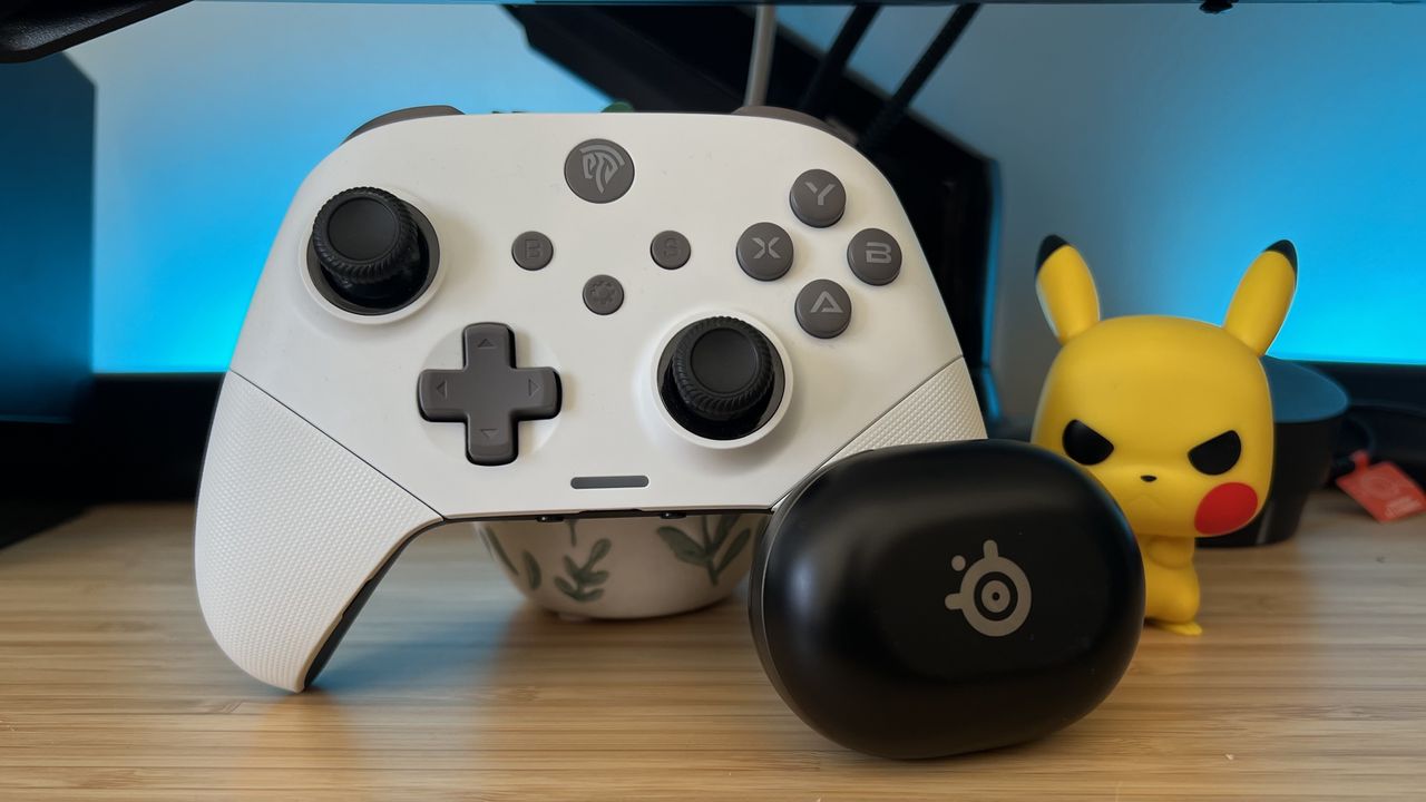 EasySMX X10 controller with SteelSeries Arctis Game Buds on a wooden desk