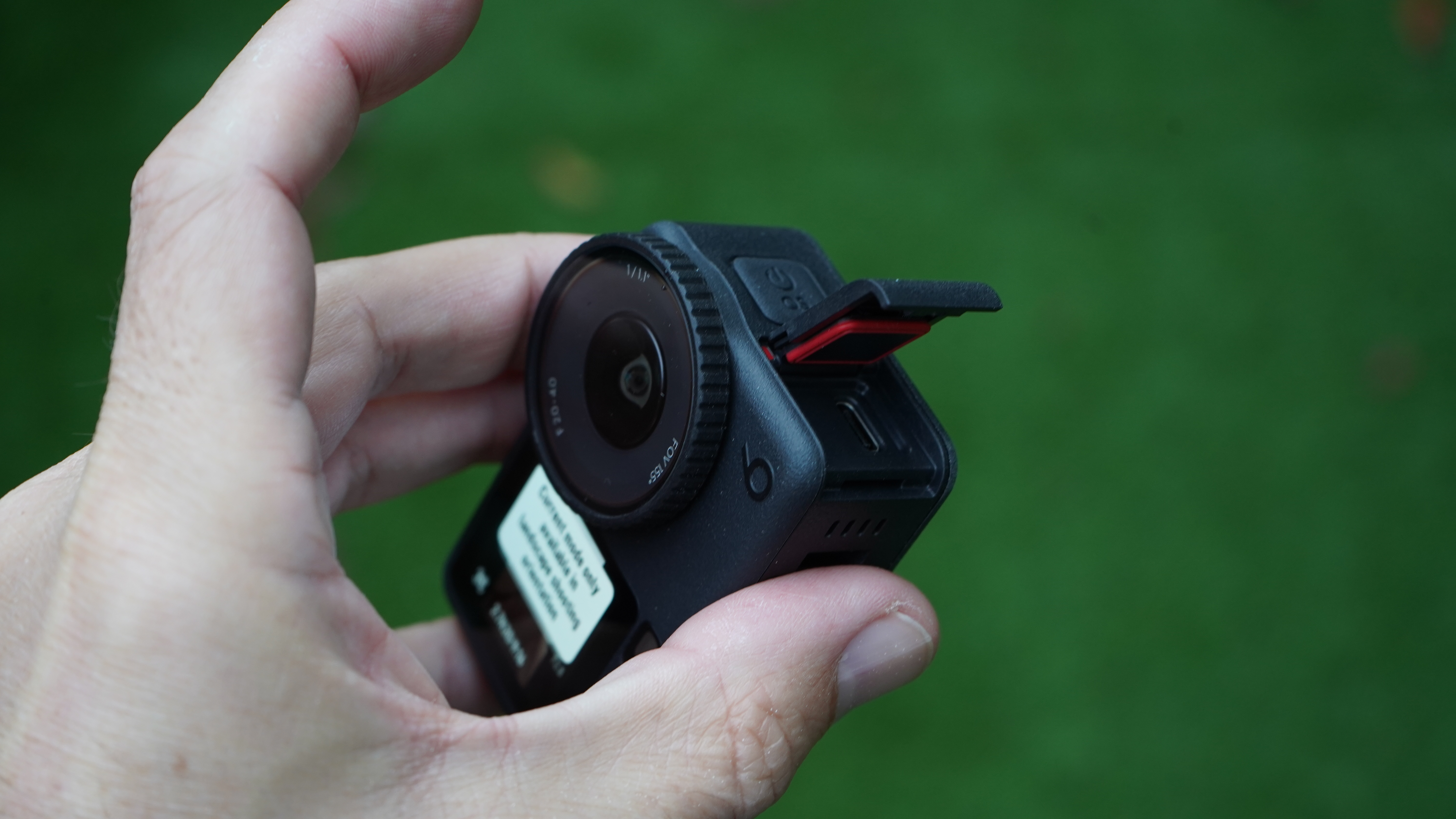 DJI Osmo Action 6 with USB-C flap open to see waterproofing