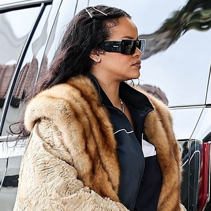 Rihanna in a massive fur coat and designer pearl crocs while out shopping in Beverly Hills with A$AP Rocky on December 14, 2024.