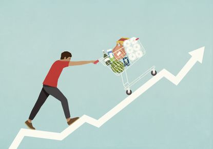 Man pushing shopping cart of groceries up line chart arrow.