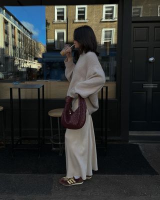 Gen Z Spring Buys: @francescasaffari styles her Adidas SL 72's with a satin maxi skirt and knit jumper