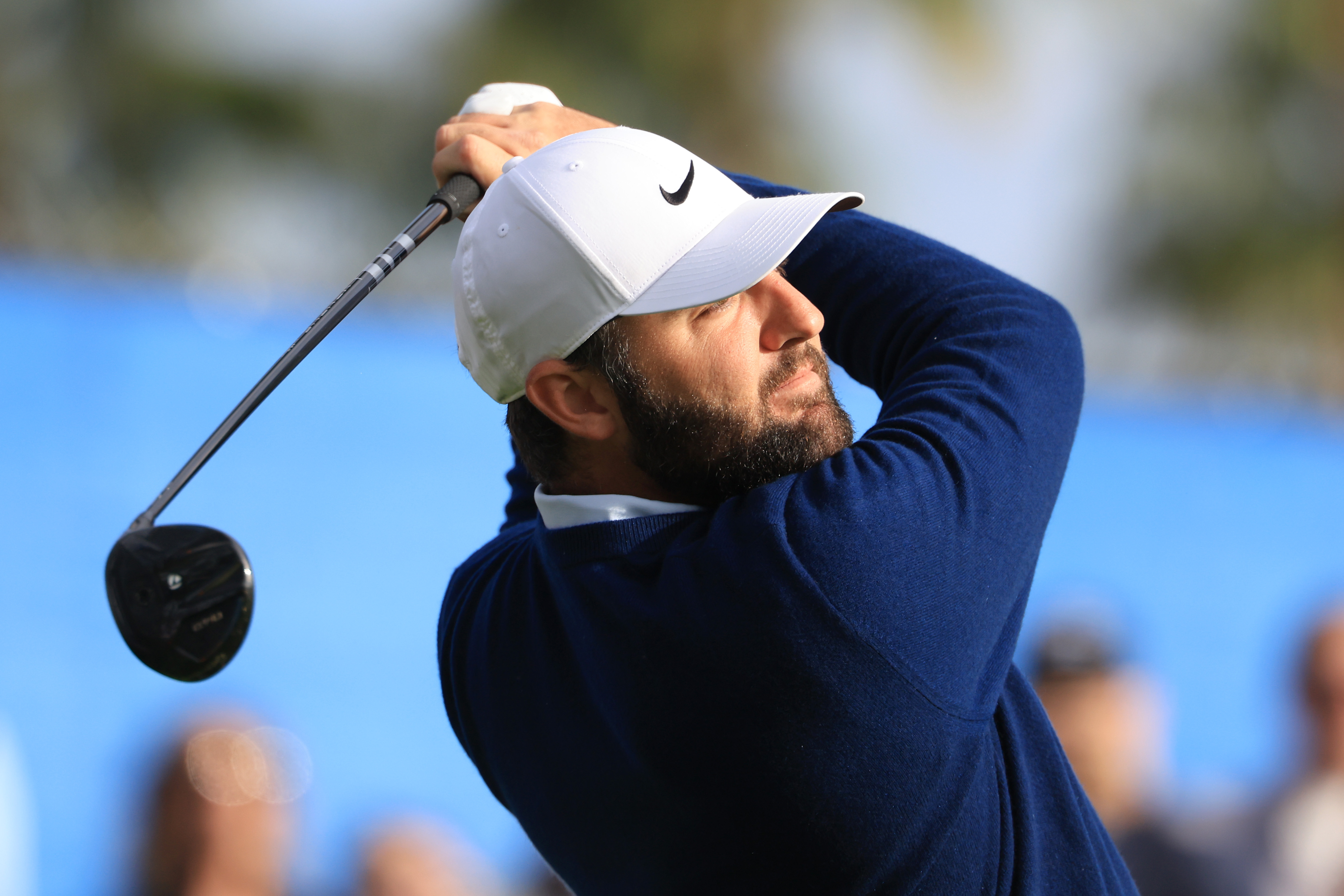 Scottie Scheffler hits a fairway wood off the tee