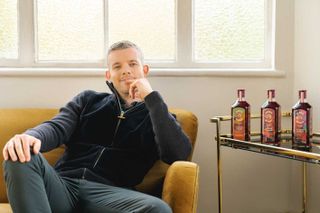 Russell Tovey with artist designed bottles