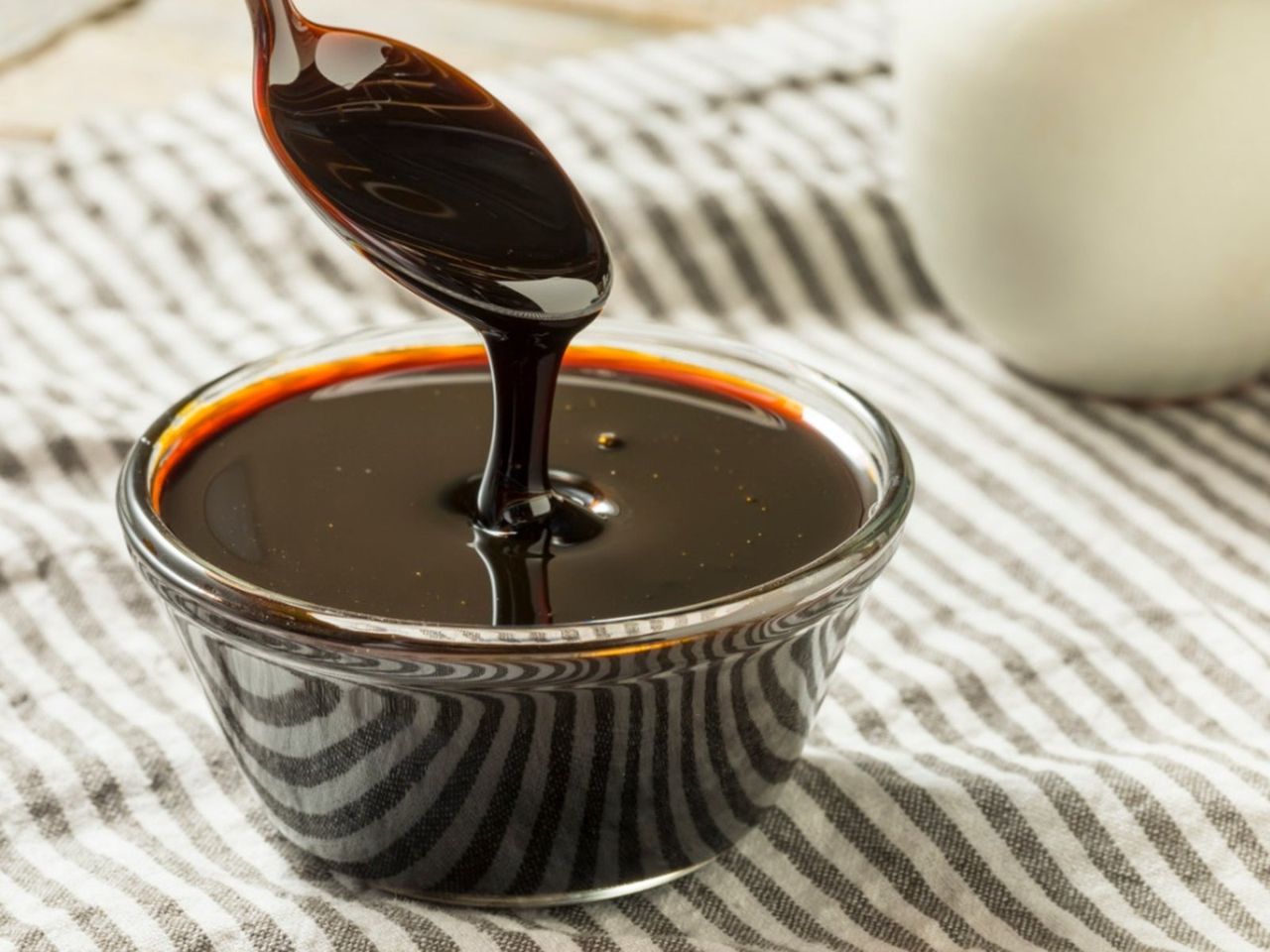 Spoon Dipping Into Molasses