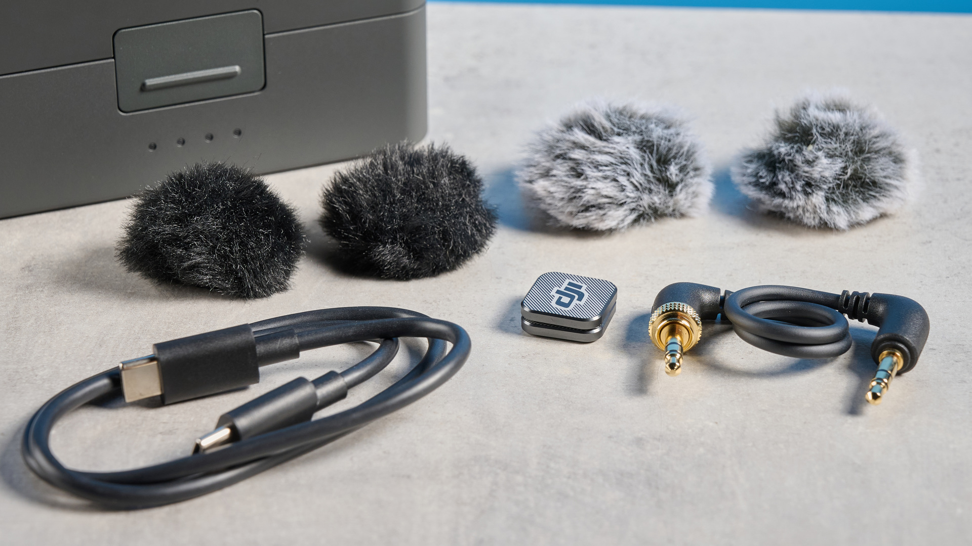 The DJI Mic 3 accessories on a table