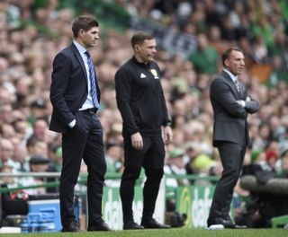 Gerrard (left) watched Rangers lose 1-0 to Brendan Rodgers' Celtic in his first Old Firm clash back in 2018