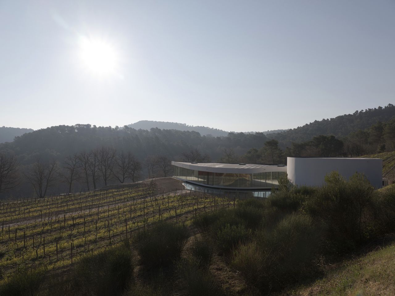 Niemeyer pavilion at chateau la coste seen among the green landscape