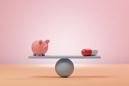 Conceptual image of a seesaw with a piggybank and an oversized pharmaceutical pill balancing on it, could illustrate ideas around cost, savings or inflation around medication